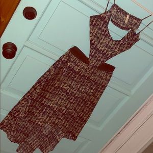 Fun, cut out style print dress. Elastic waist.